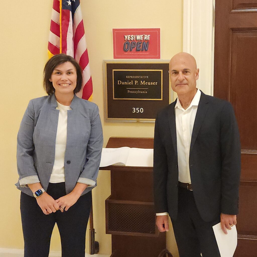 Joanna Hart and Scott Halpern pose in front of Pennsylvania Representative Daniel P. Meuser's office.