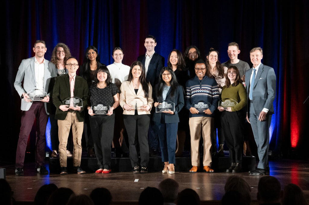 Photo of the the JRP members with their awards and Dr. J Larry Jameson on stage at the Models of Excellence Awards Ceremony.